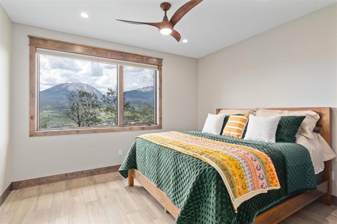 344 Angler Mountain Ranch Road Silverthorne, CO 80498 - Photo 19 of 32 a bedroom with a bed and a window