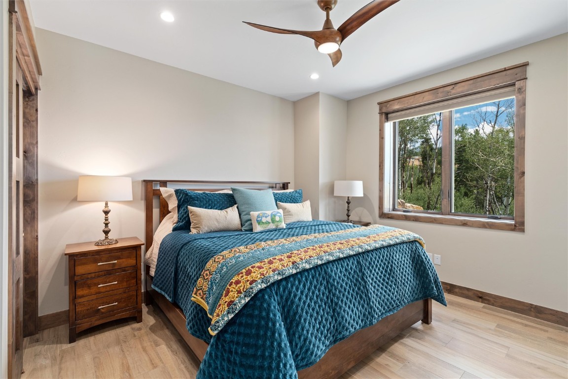 344 Angler Mountain Ranch Road Silverthorne, CO 80498 - Photo 26 of 32 a bedroom with a bed and large window