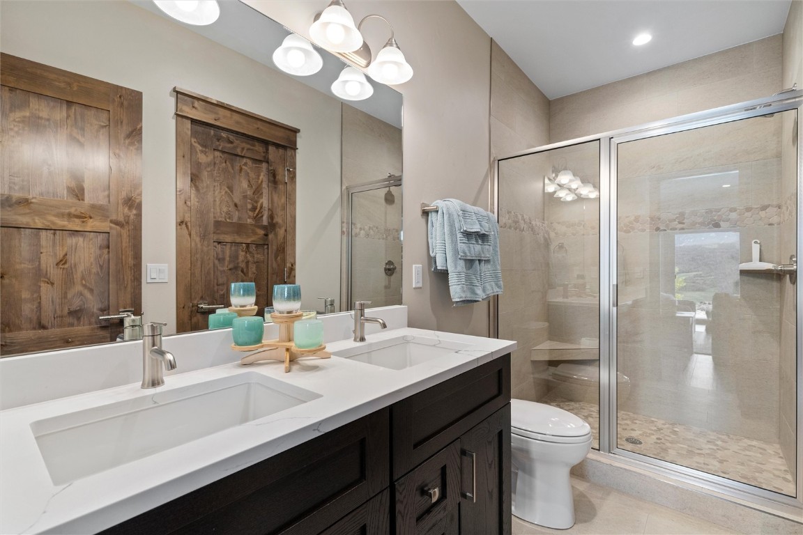 344 Angler Mountain Ranch Road Silverthorne, CO 80498 - Photo 27 of 32 a bathroom with a sink a toilet and shower
