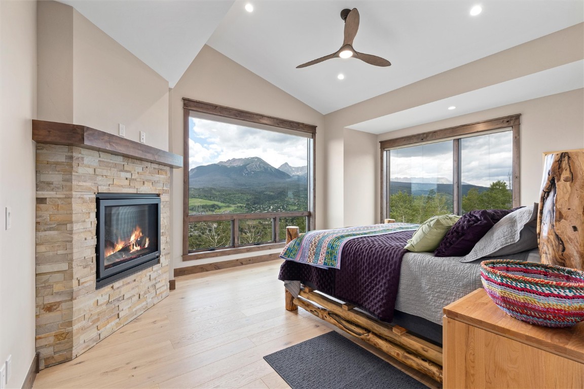 344 Angler Mountain Ranch Road Silverthorne, CO 80498 - Photo 4 of 32 a living room with furniture and a fireplace