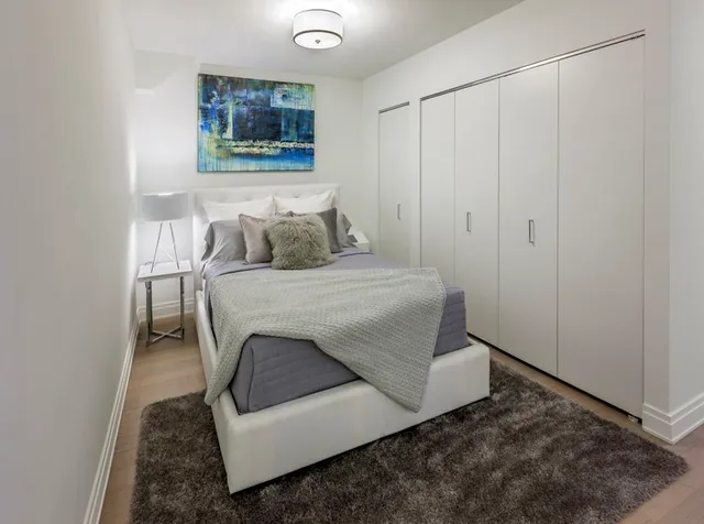a kitchen with stainless steel appliances a microwave a stove and white cabinets
