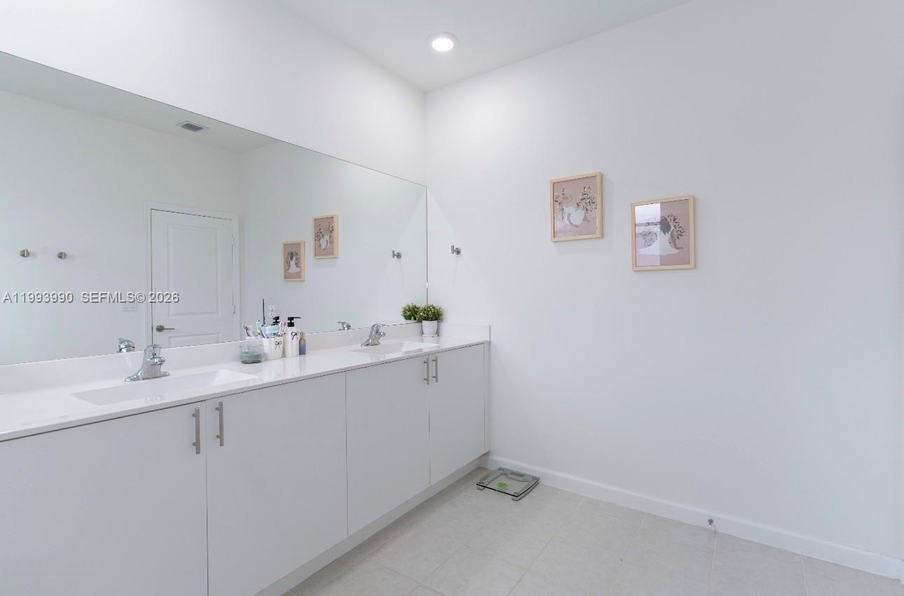 16222 Southwest 290th Terrace, Unit 16222 Homestead, FL 33033 - Photo 20 of 38 a utility room with a sink dryer and washer