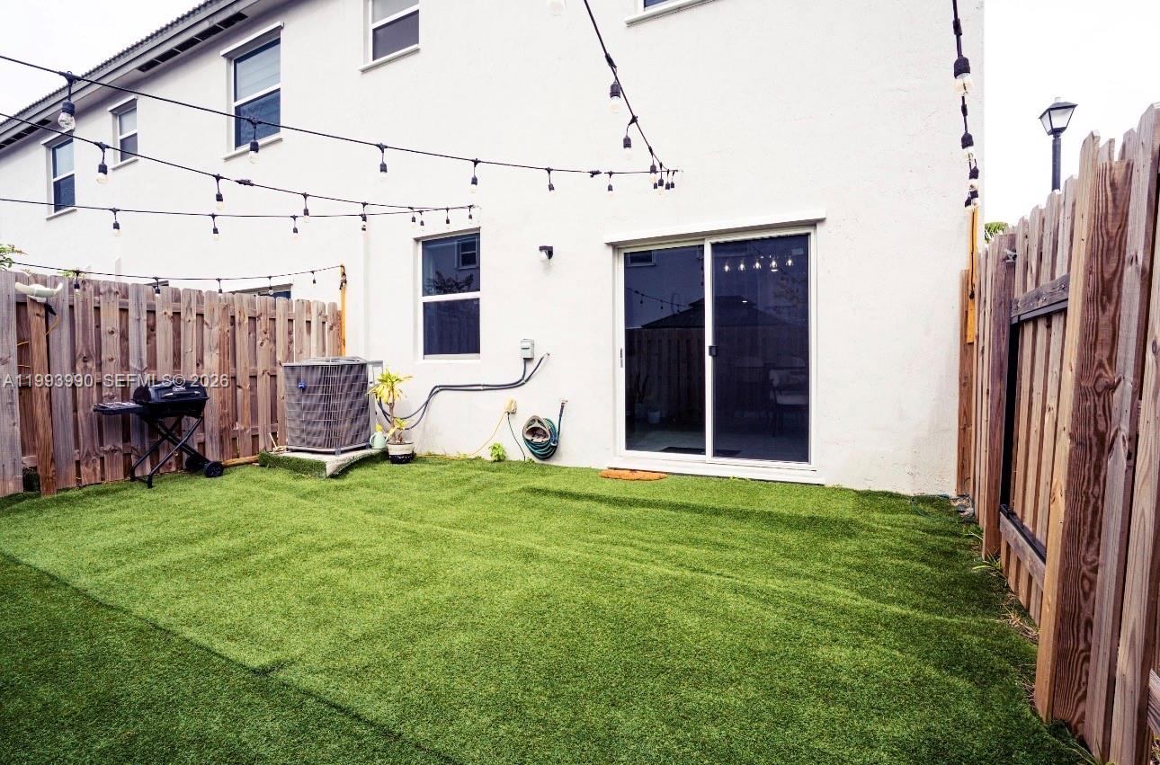 16222 Southwest 290th Terrace, Unit 16222 Homestead, FL 33033 - Photo 32 of 38 a view of a back yard of the house