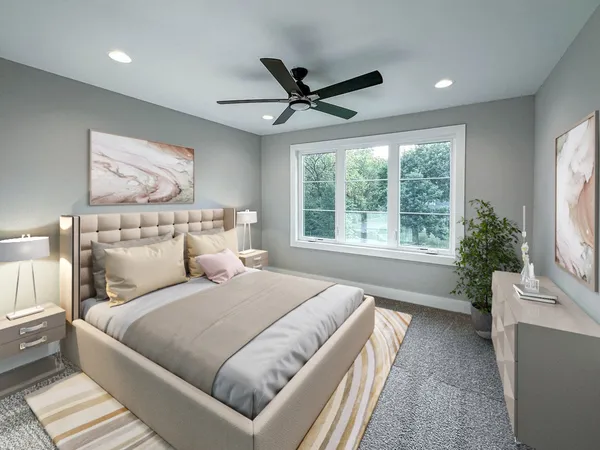 a bedroom with a large bed and a large window