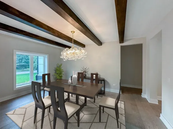 a view of a dining room with furniture and window