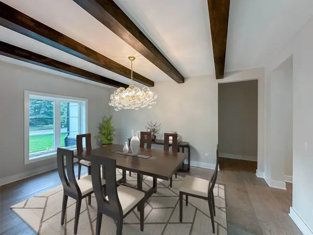 a view of a dining room with furniture and window
