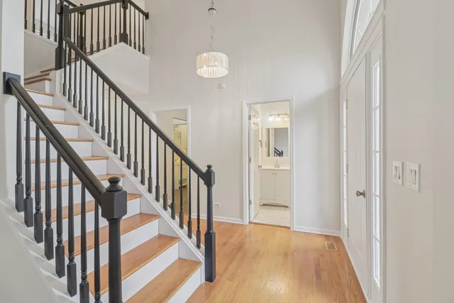 a view of an entryway with wooden floor
