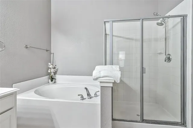 a bathroom with a sink a mirror and shower