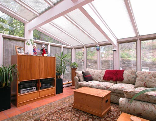 45 Waban Hill Road Newton, MA 02467 - Photo 3 of 4 a living room with furniture a flat screen tv and a floor to ceiling window