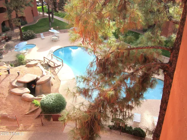 a room with furniture pool table and windows