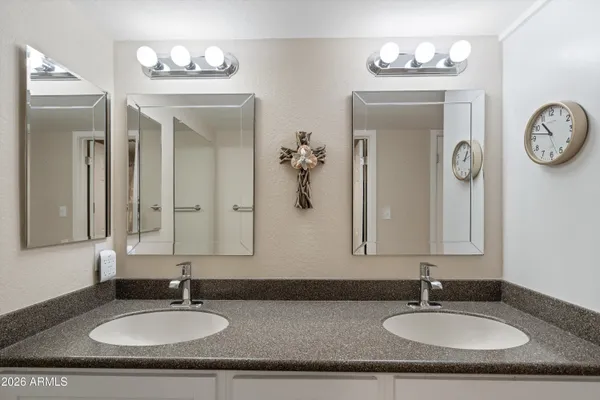 a living room with furniture and view of kitchen