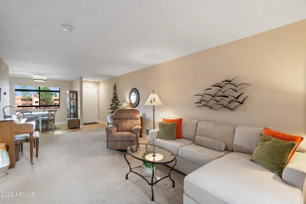 a living room with furniture and a large window