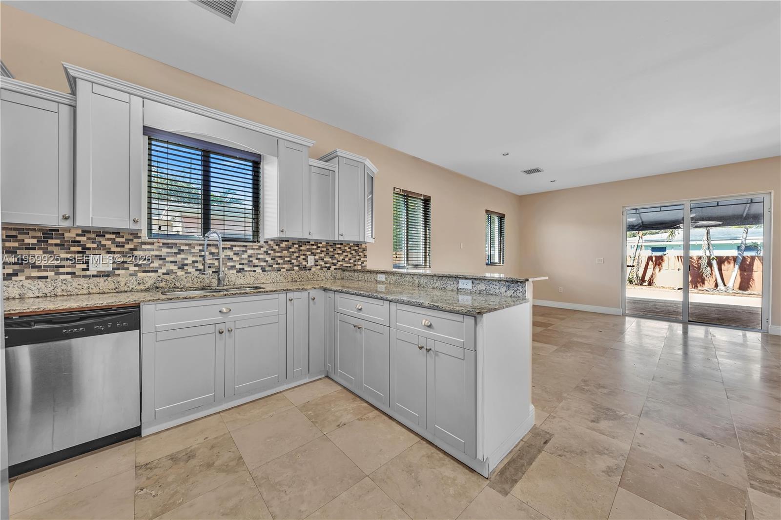 4025 Southwest 10th Street Miami, FL 33134 - Photo 15 of 41 a spacious bathroom with a granite countertop sink and a large mirror