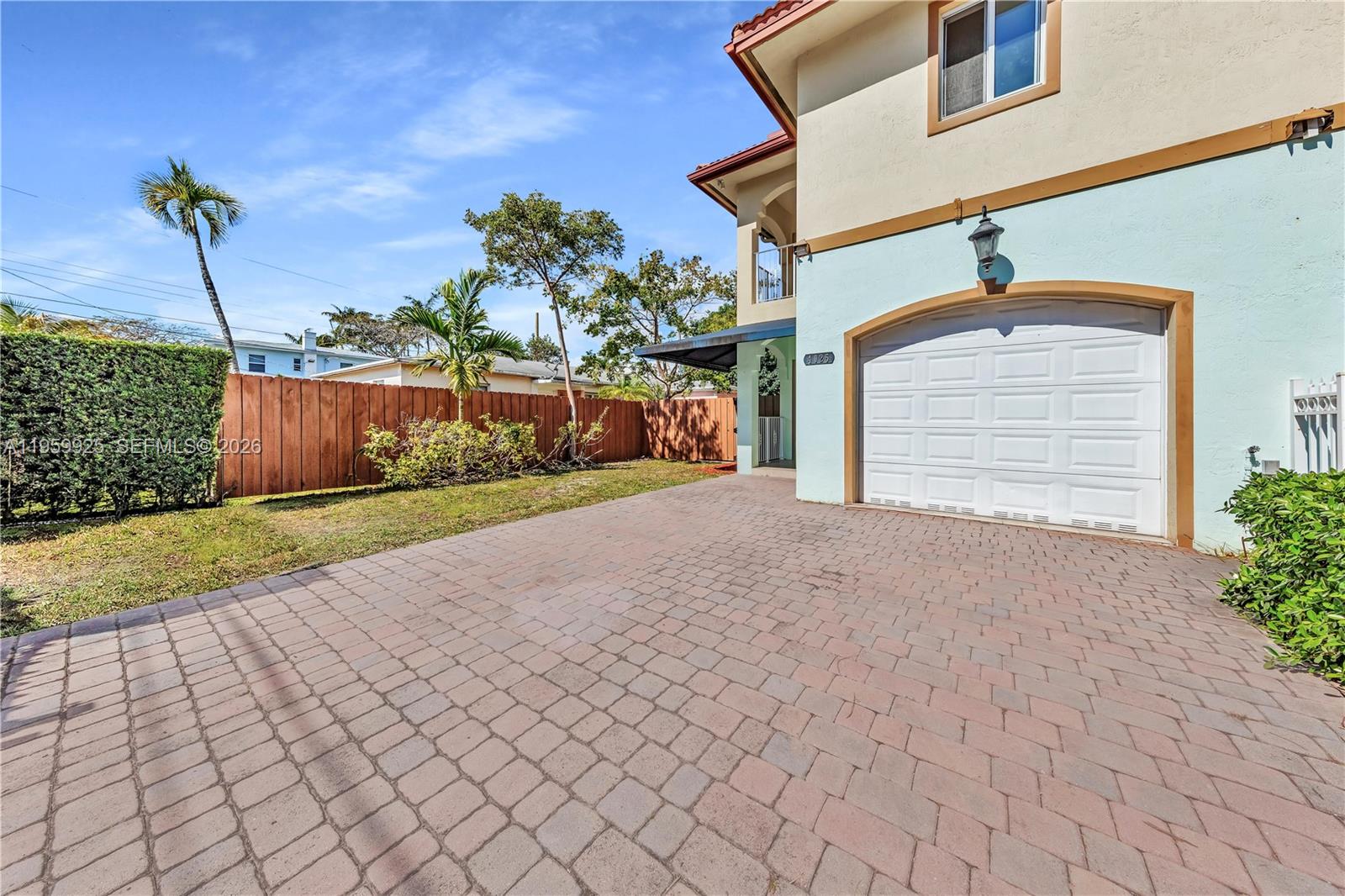 4025 Southwest 10th Street Miami, FL 33134 - Photo 4 of 41 a view of a house with a yard and garage
