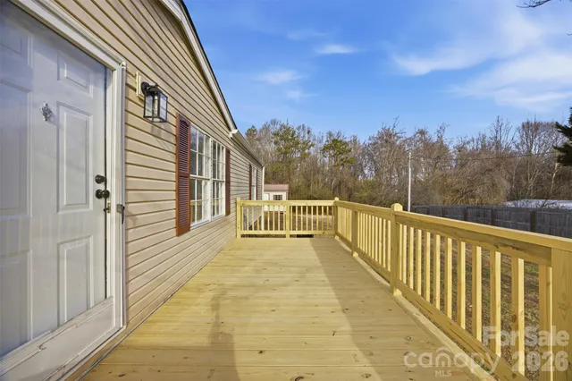 a view of a balcony with trees