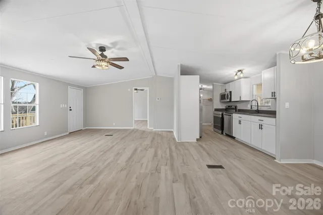 a view of a kitchen with a stove cabinets and wooden floor