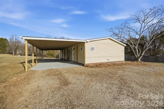 a view of a backyard with a table and chair