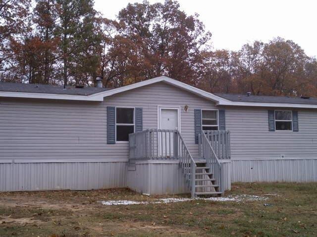 111 Madden Road Kingston, GA 30145 - Photo 1 of 1 a front view of a house with a garden