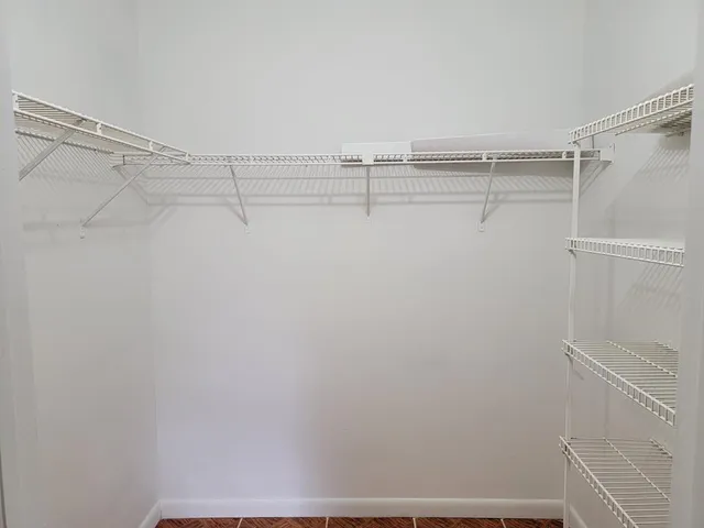 a view of a room with racks on the wall