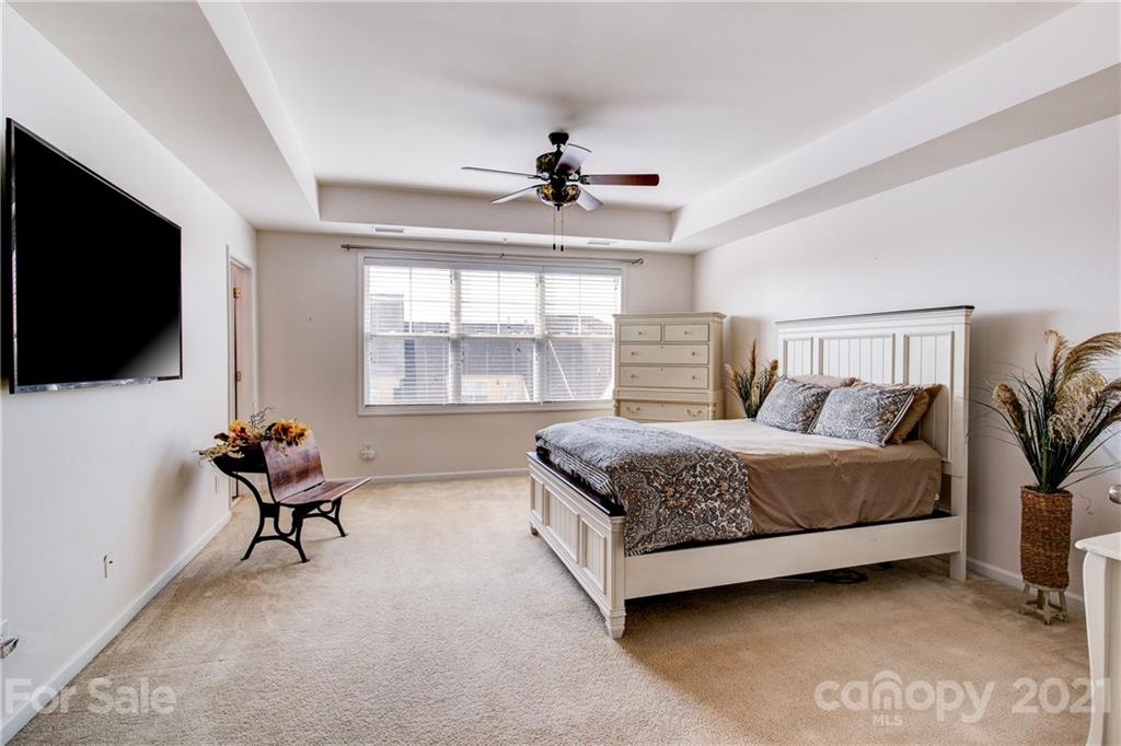110 Inlet Point Drive, Unit 62 Tega Cay, SC 29708 - Photo 22 of 47 a bedroom with a bed and tv