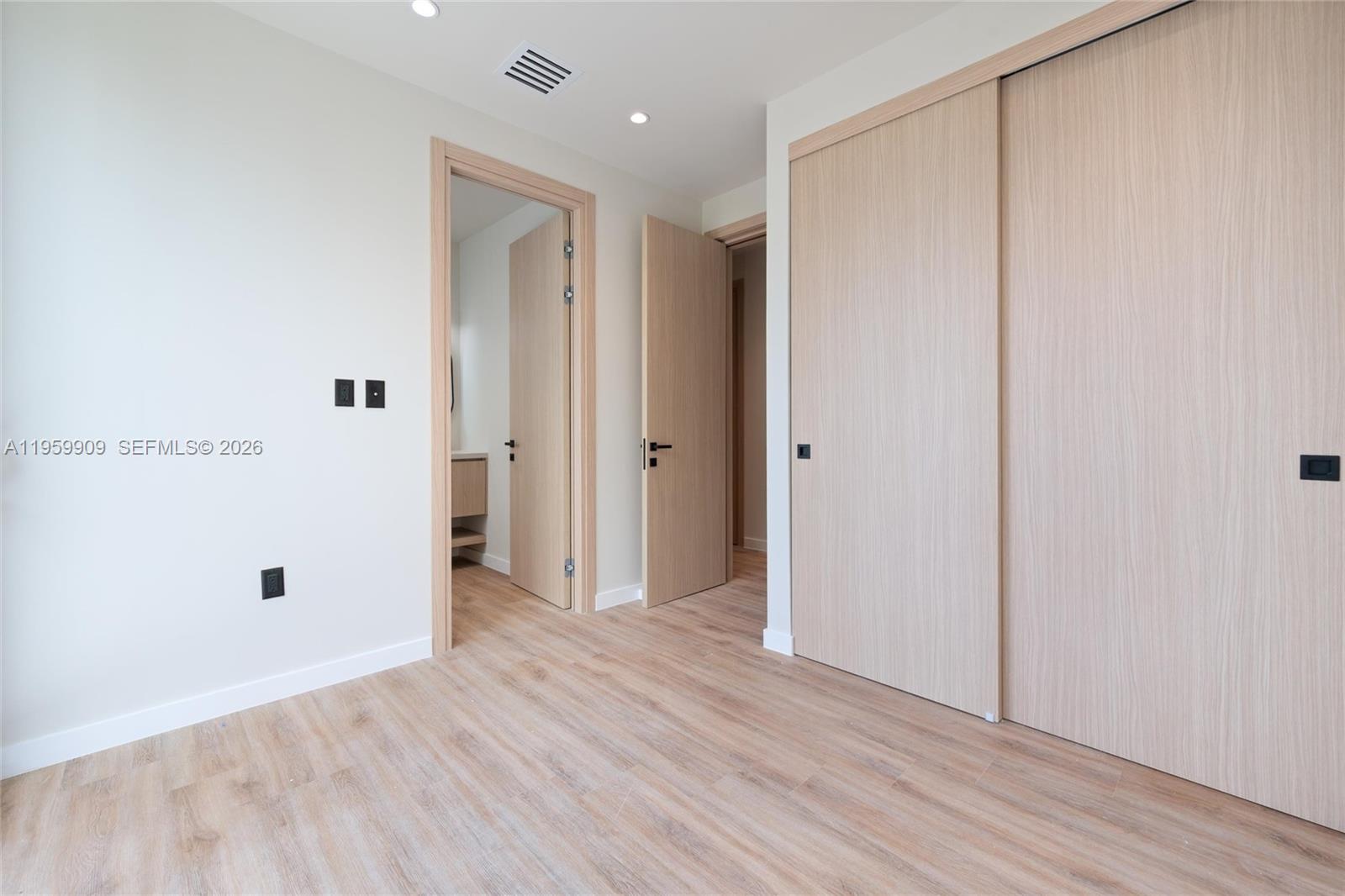 2330 Southwest 36th Avenue, Unit 2 Miami, FL 33145 - Photo 11 of 19 a view of an empty room with wooden floor