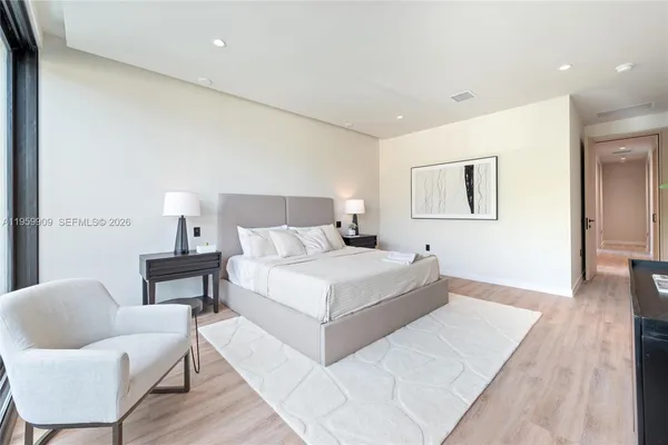 a bedroom with a bed and a couch