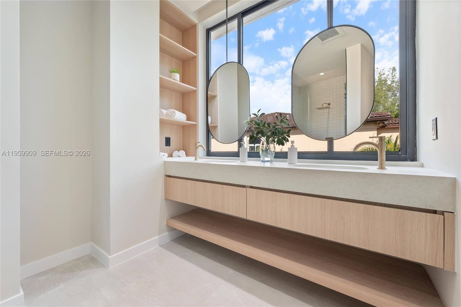 2330 Southwest 36th Avenue, Unit 2 Miami, FL 33145 - Photo 15 of 19 a bathroom with a double vanity sink and a mirror