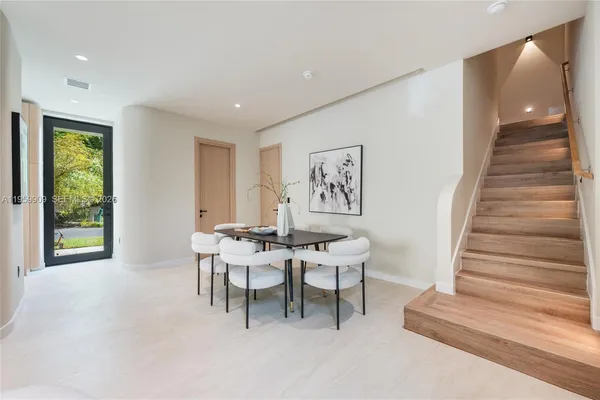 a view of a livingroom with furniture and entryway