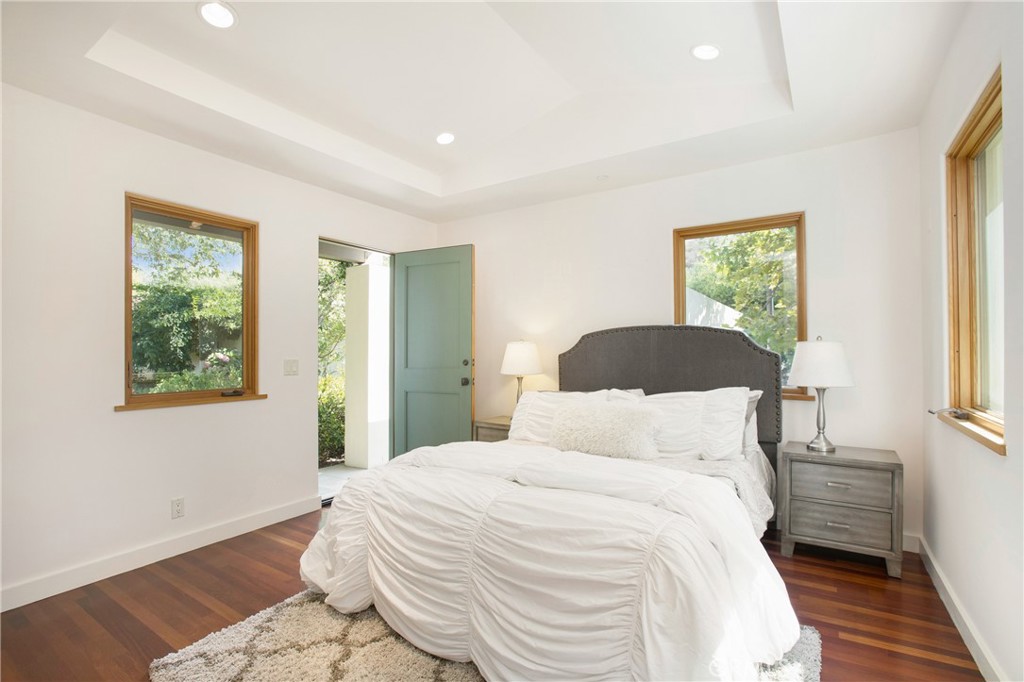 28100 Modjeska Canyon Road Silverado, CA 92676 - Photo 11 of 30 a bedroom with a bed and a large window