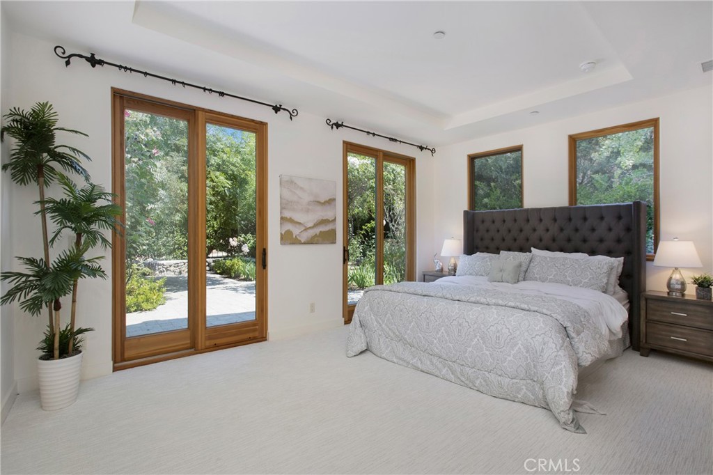 28100 Modjeska Canyon Road Silverado, CA 92676 - Photo 12 of 30 a spacious bedroom with a large bed and a large window