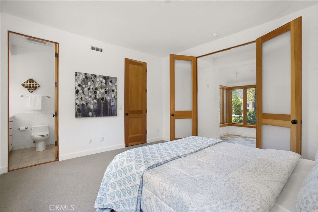 28100 Modjeska Canyon Road Silverado, CA 92676 - Photo 15 of 30 a bedroom with a large bed and a window