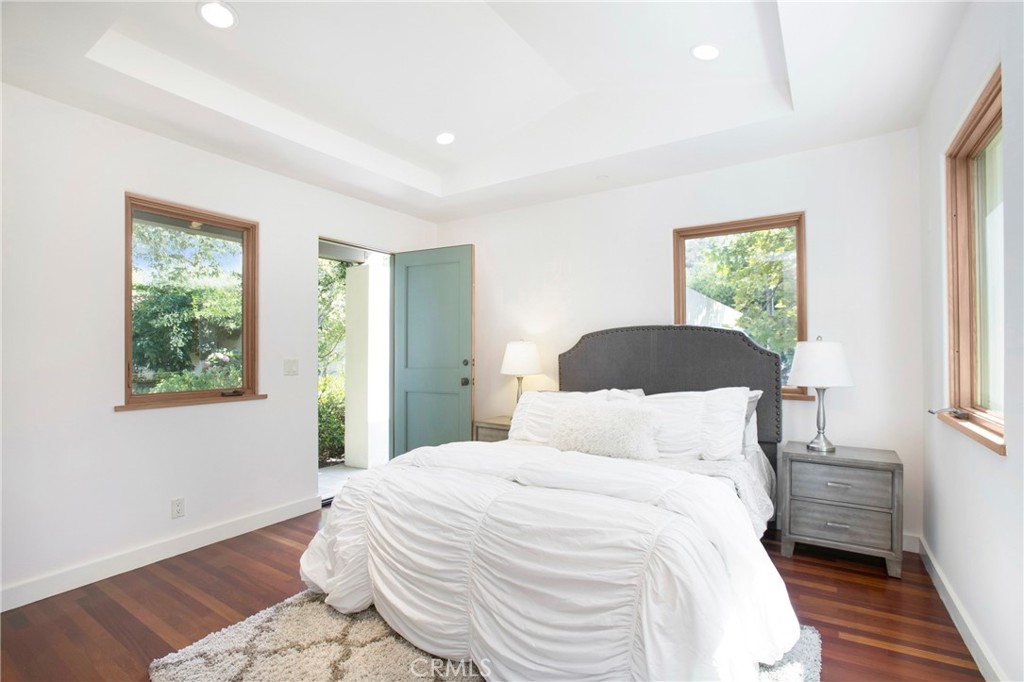 28100 Modjeska Canyon Road Silverado, CA 92676 - Photo 17 of 30 a bedroom with a bed and a large window