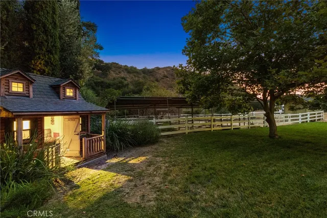 a view of a house with a yard and garage