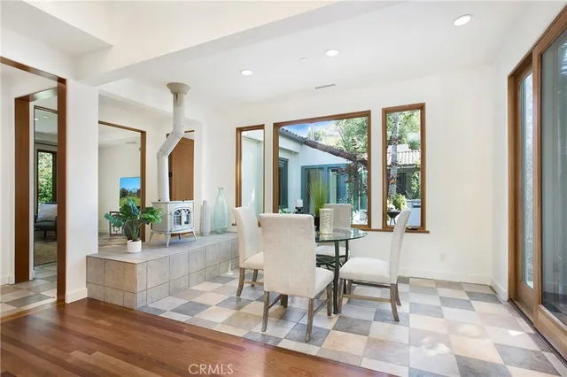 a living room with furniture and large windows