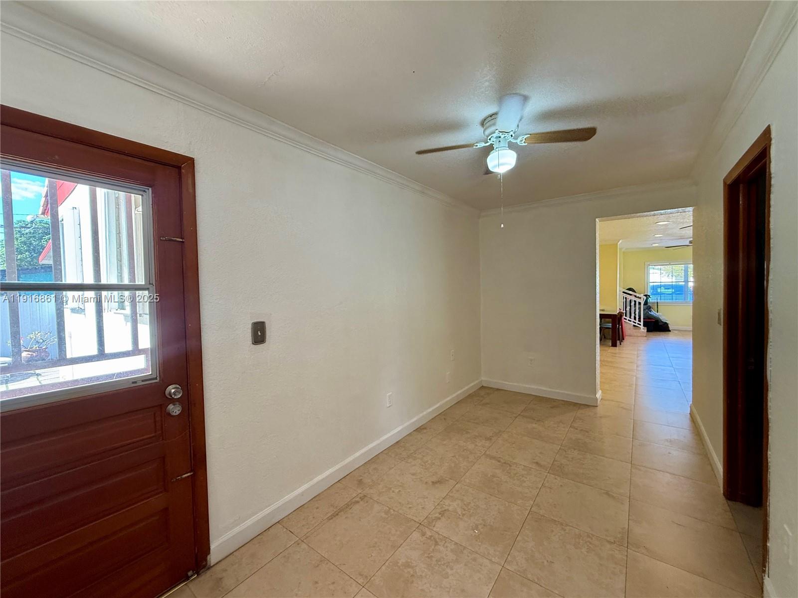 174 East 41st Street Hialeah, FL 33013 - Photo 23 of 46 wooden floor in an empty room with a window