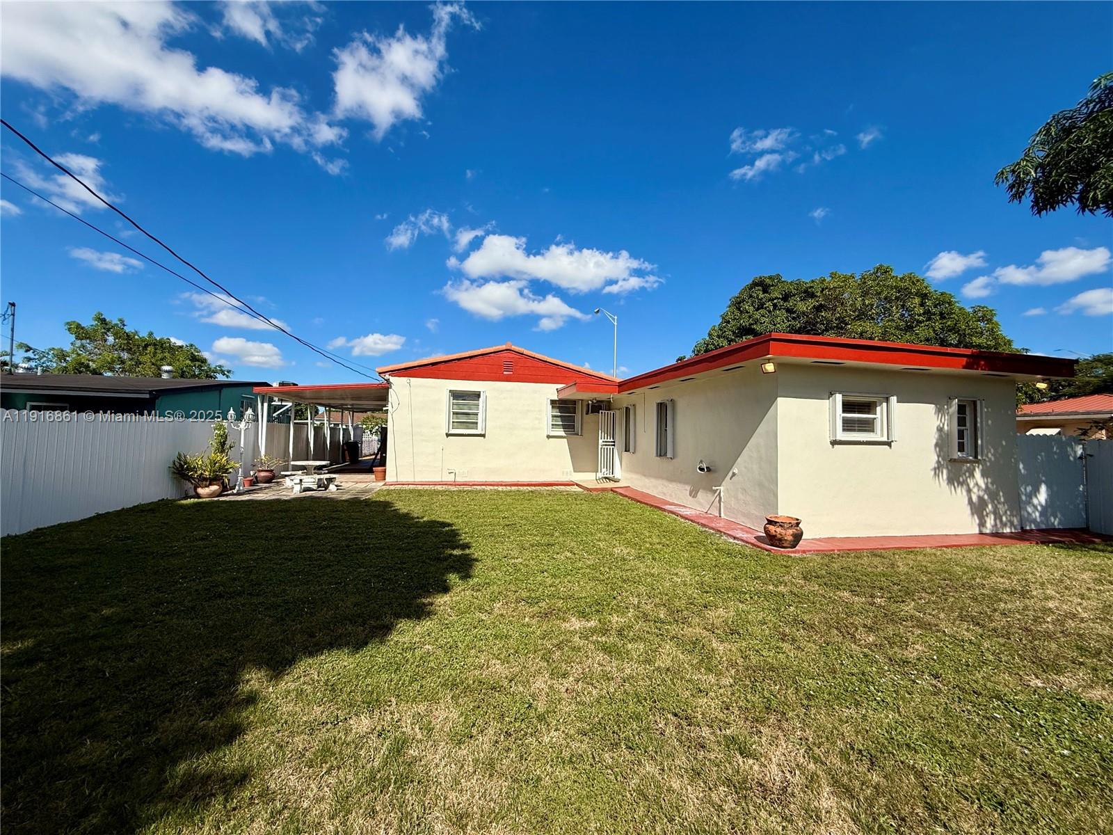 174 East 41st Street Hialeah, FL 33013 - Photo 25 of 46 a view of a house with a yard