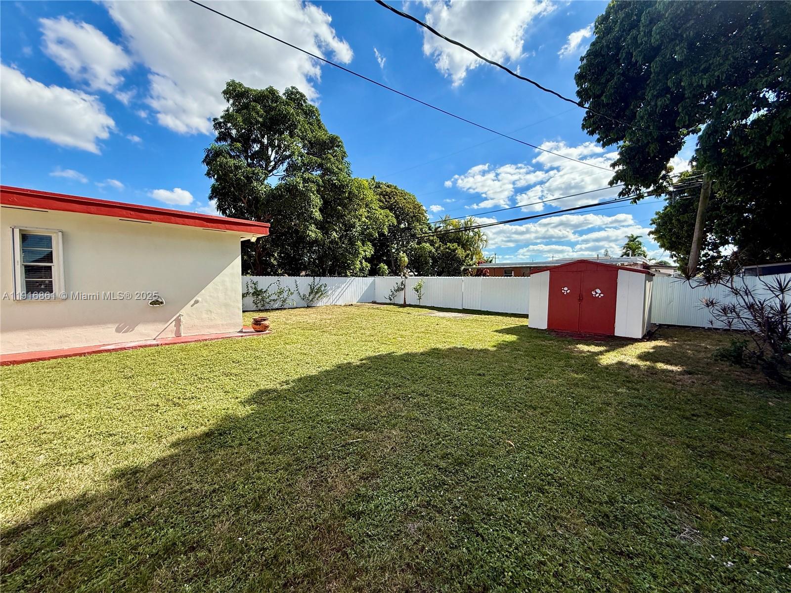174 East 41st Street Hialeah, FL 33013 - Photo 28 of 46 a view of a house with a yard