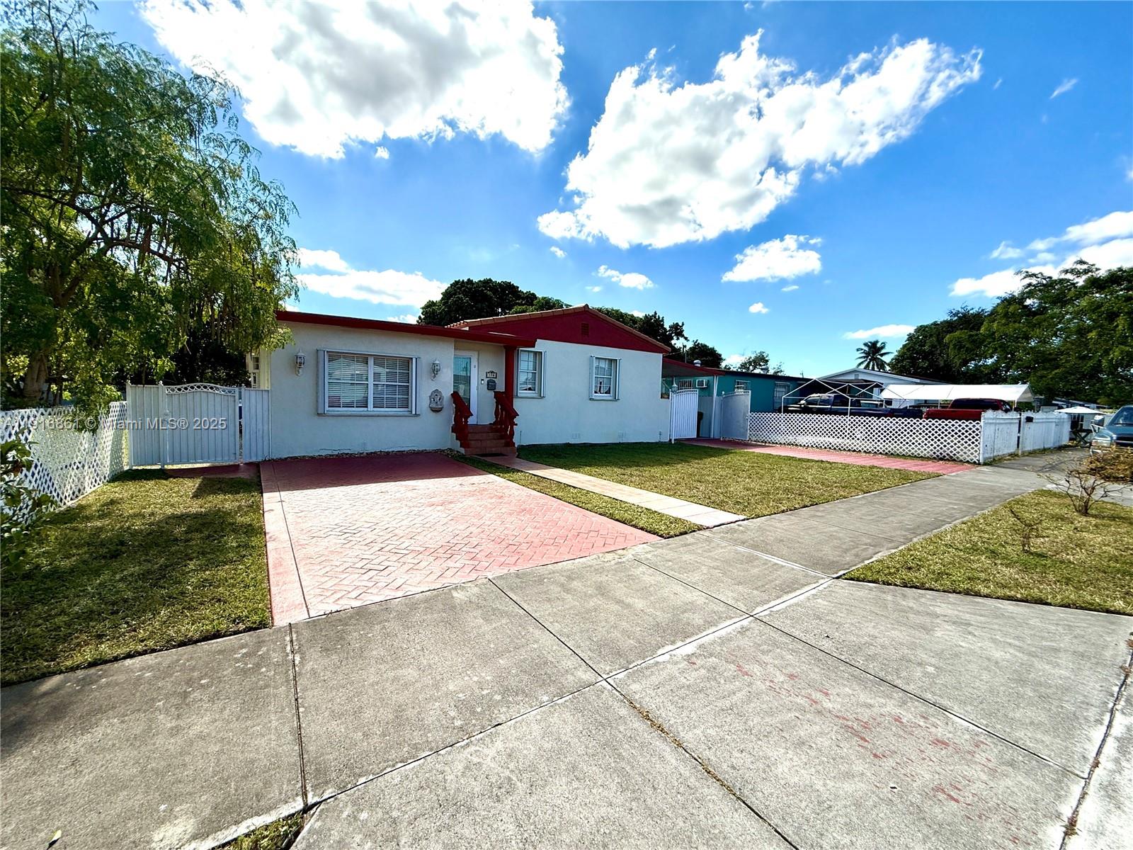 174 East 41st Street Hialeah, FL 33013 - Photo 3 of 46 a view of a house with swimming pool and a yard