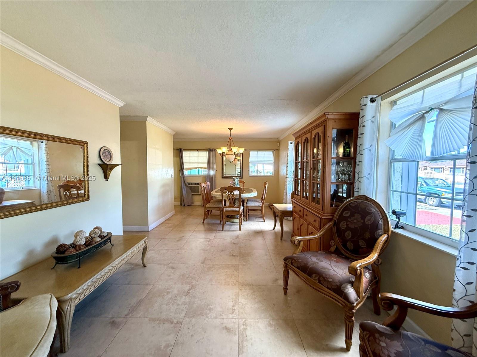 174 East 41st Street Hialeah, FL 33013 - Photo 31 of 46 a room with furniture and wooden floor