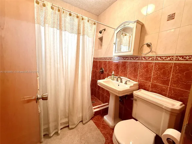 a bedroom with bed and window