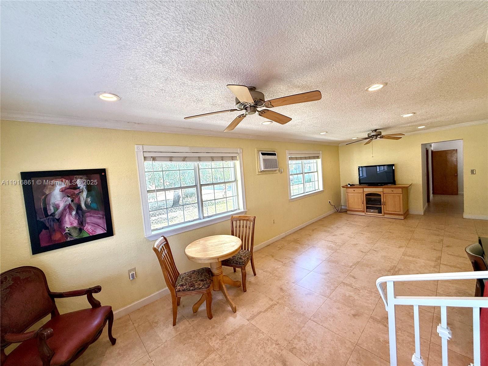 174 East 41st Street Hialeah, FL 33013 - Photo 10 of 46 a living room with furniture and a window