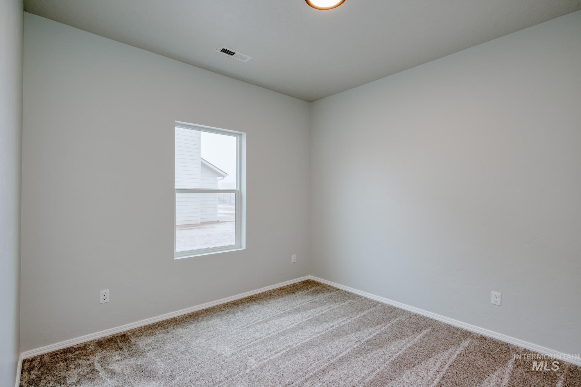 13696 Nisene Street Caldwell, ID 83607 - Photo 13 of 24 Unfurnished room with carpet floors and baseboards