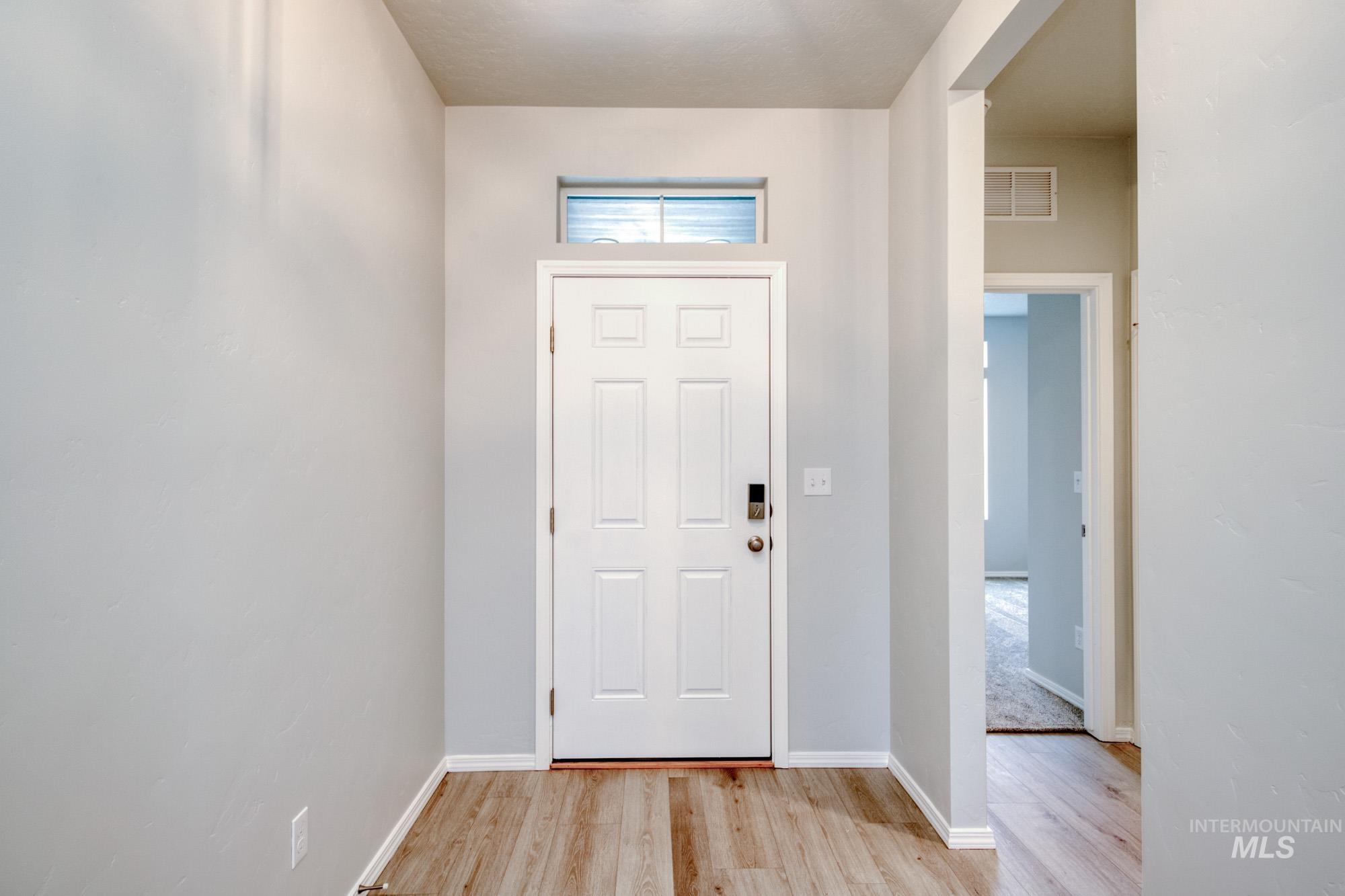 13696 Nisene Street Caldwell, ID 83607 - Photo 2 of 24 Entryway with light wood-type flooring and baseboards