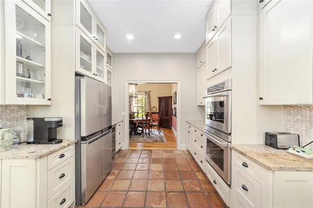 a room with a sink cabinets and utility room