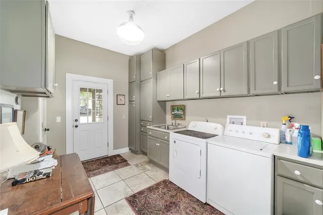 a living room with fireplace furniture and a flat screen tv
