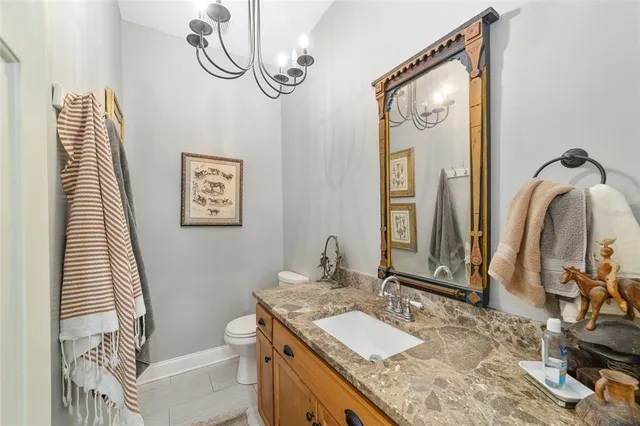 a bedroom with a bed and a tv on the dresser