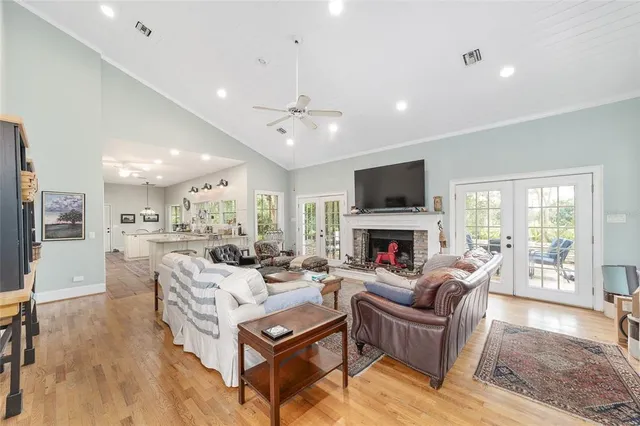 a living room with furniture and a floor to ceiling window