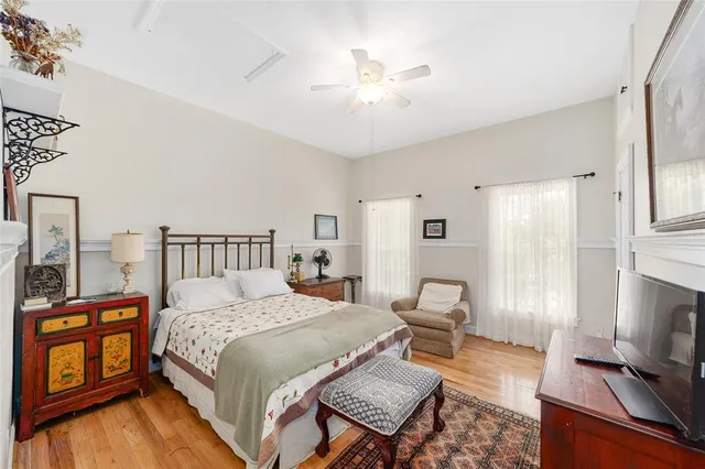 a bathroom with a granite countertop sink and a large mirror