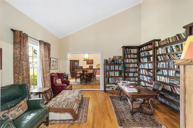 a view of a yard with wooden fence