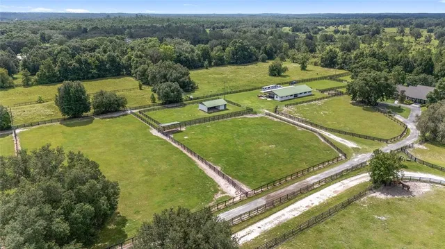 a front view of a house with potted plants